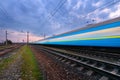 High speed blue passenger train in motion