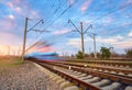 High speed blue passenger train in motion Royalty Free Stock Photo