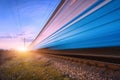High speed blue passenger train in motion on railroad Royalty Free Stock Photo