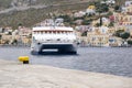 High Speed Catamaran Arriving in Main Port of Symi, Yialos, with Load of Tourists Royalty Free Stock Photo