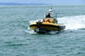 High speed rubber dinghy arriving at Alum Bay Isle of Wight.