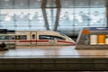 High-speed ICE train in blur motion at the airport's long-distance station