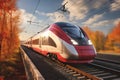 A high speed modern train moving in the countryside in autumn forest Royalty Free Stock Photo