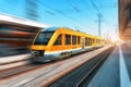 High speed orange train in motion on the railway station Royalty Free Stock Photo