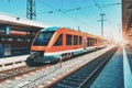 High speed orange train on the railway station at sunset Royalty Free Stock Photo