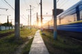 High speed passenger train in motion on railroad track at sunset Royalty Free Stock Photo