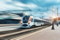 High speed passenger train in motion on railroad Royalty Free Stock Photo