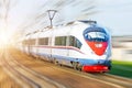 High-speed passenger train rushing through rail in Europe. Royalty Free Stock Photo