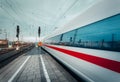 High speed passenger train on tracks in motion Royalty Free Stock Photo