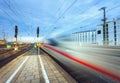 High speed passenger train on tracks in motion Royalty Free Stock Photo