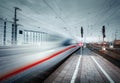 High speed passenger train on tracks in motion Royalty Free Stock Photo