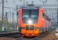 High-speed red passenger train rushing through the railway. Royalty Free Stock Photo