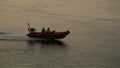 High speed rescue boats passing sun set