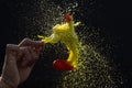 High speed shot of a colors filled balloon burst