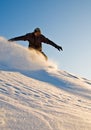 High Speed Snowboarder At Sunset