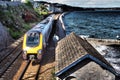 High speed train alongside sea wall at Dawlish, South Devon Royalty Free Stock Photo