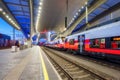 High speed train on the modern railway station at night