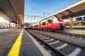 High speed train on the modern railway station at sunset Royalty Free Stock Photo