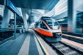 High speed train in motion at modern railway station Royalty Free Stock Photo