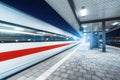 High speed train in motion on the railway station at night Royalty Free Stock Photo