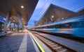 High speed train in motion on the railway station at night