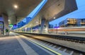 High speed train in motion on the railway station at night