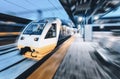 High speed train in motion on the railway station at night Royalty Free Stock Photo