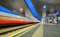 High speed train in motion on the railway station at night