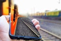 High speed train in motion on the railway station at sunset. Fast moving modern passenger train on railway platform. Railroad with Royalty Free Stock Photo