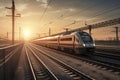 High speed train in motion on the railway station at sunset Royalty Free Stock Photo