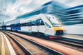 High speed train in motion on the railway station at sunset Royalty Free Stock Photo