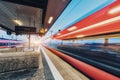 High speed train in motion on the railway station at sunset Royalty Free Stock Photo