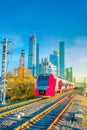 High-speed train moves to the station amid the business center Royalty Free Stock Photo