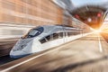 High speed train passing near the passenger station