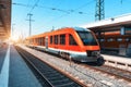 High speed train on the railway station at sunset in summer Royalty Free Stock Photo