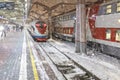A high-speed train stands on the platform of the station waiting for departure. Winter, snowfall Royalty Free Stock Photo