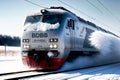 High-speed train traveling in winter through snow to station railway transport Royalty Free Stock Photo