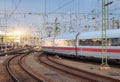 High speed white passenger train on railroad track