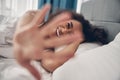 Beautiful mischievous young lady laughing in bed Royalty Free Stock Photo