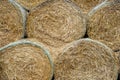 High Stack Of Round Dry Hay Bales On A Farm Field