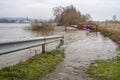 The high state of the river Rhine in western Germany, which emerged from the riverbed, flooded pavement and bicycle path.