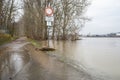 The high state of the river Rhine in western Germany, which emerged from the riverbed, flooded pavement and bicycle path.