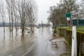 The high state of the river Rhine in western Germany, which emerged from the riverbed, flooded pavement and bicycle path.