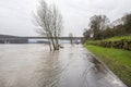 The high state of the river Rhine in western Germany, which emerged from the riverbed, flooded pavement and bicycle path.