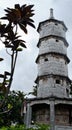 High stone five-storey pagoda in light fog