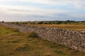 High stone wall in sunset Royalty Free Stock Photo