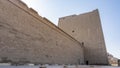 The high stone walls of the temple of Horus in Edfu.