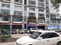 High street with branded shops in Dhaka, Bangladesh