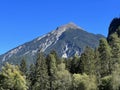 High swiss alpine peak Muchetta (2623 m) above the tourist-agricultural village Alvaneu Bad (Alvagni Bogn)