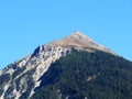 High swiss alpine peak Muchetta (2623 m) above the tourist-agricultural village Alvaneu Bad (Alvagni Bogn)